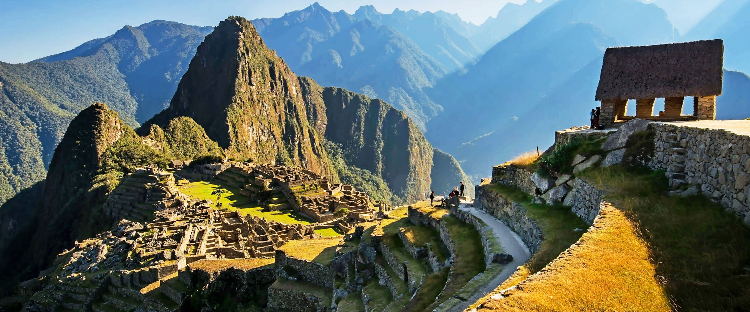 Machu Picchu landscape at sunrise, Inca archaeology, Peru tourist destination, Andean Ecotravel tours.